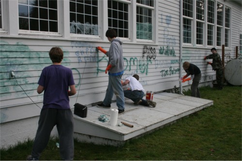 Scouts remove graffiti from Nichols Center